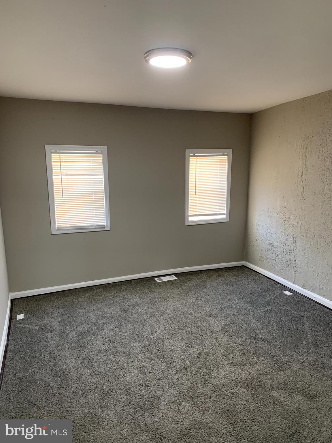 2708 Mathews Street Baltimore, MD 21218 - Photo 14 of 20 an empty room with a window