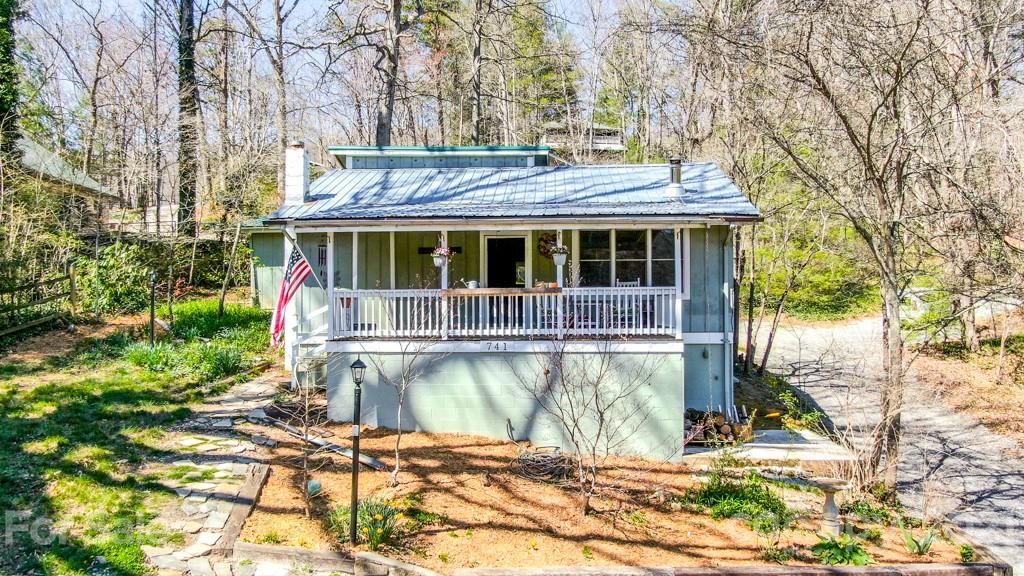 741 County Road Waynesville, NC 28785 - Photo 1 of 42 a view of a house with a yard
