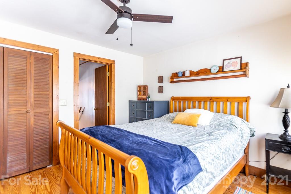 741 County Road Waynesville, NC 28785 - Photo 16 of 42 a bedroom with a bed and dresser