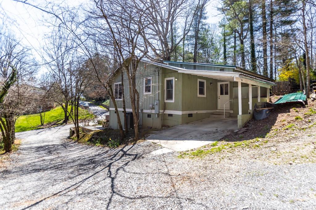 741 County Road Waynesville, NC 28785 - Photo 22 of 42 a view of a house with a yard