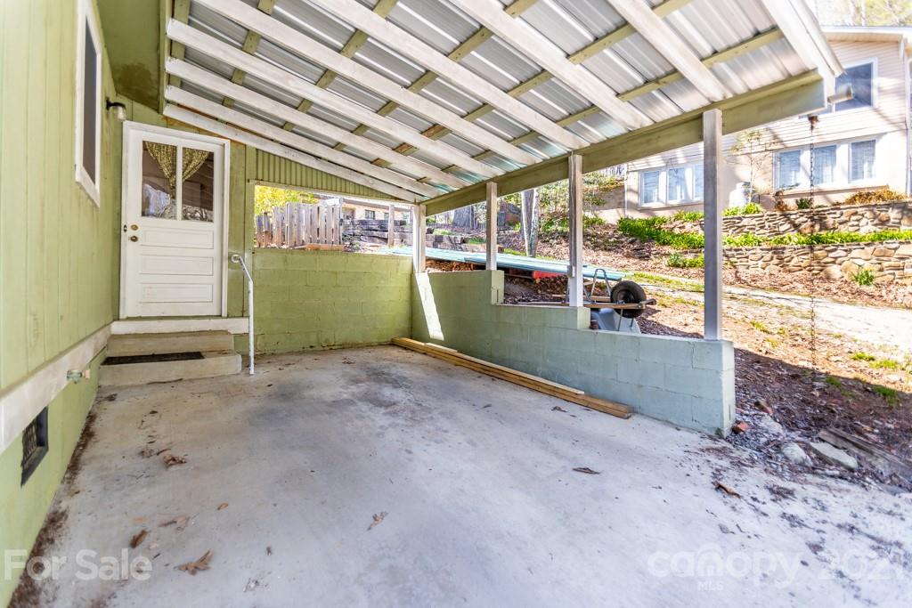 741 County Road Waynesville, NC 28785 - Photo 23 of 42 a view of a room with wooden walls