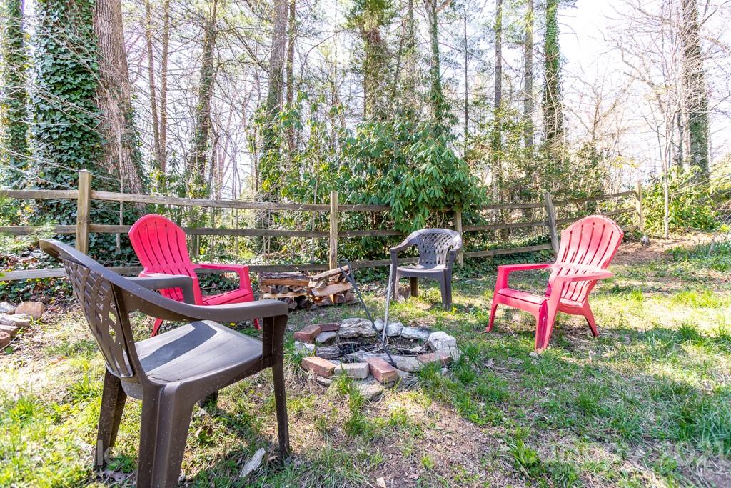 741 County Road Waynesville, NC 28785 - Photo 27 of 42 a backyard of a house with outdoor seating