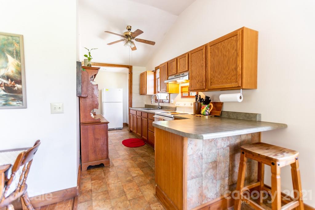 741 County Road Waynesville, NC 28785 - Photo 4 of 42 a kitchen with a sink appliances and cabinets