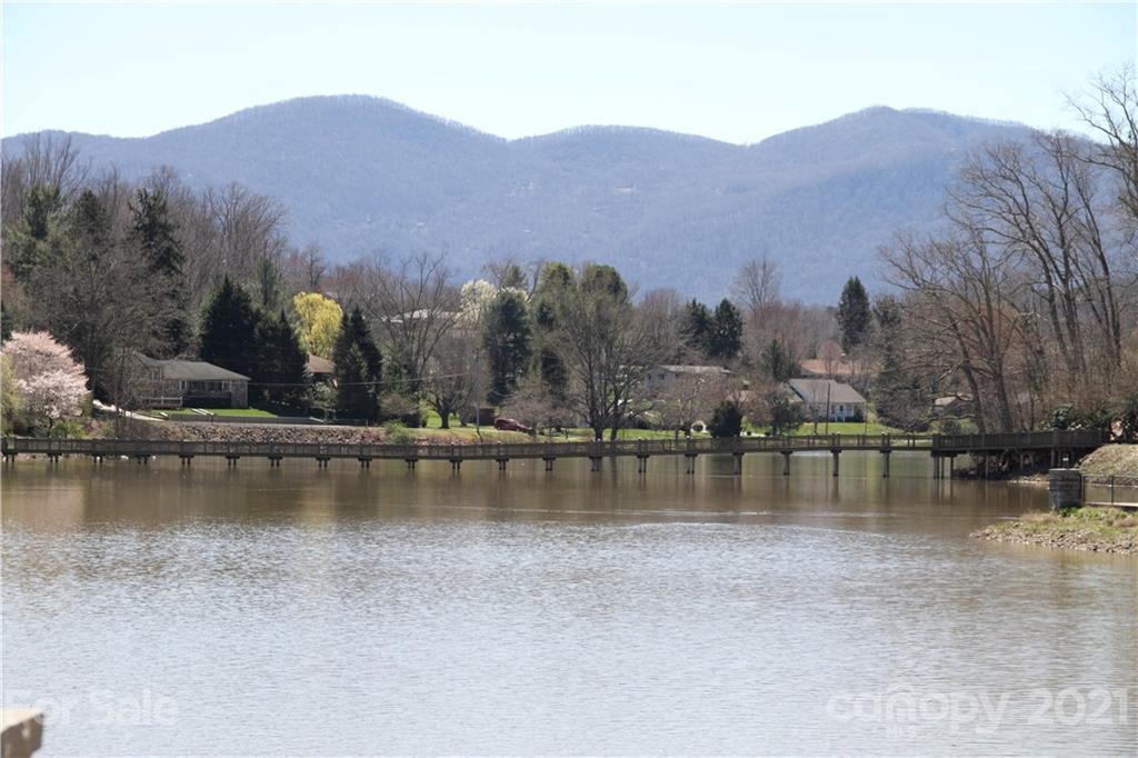 741 County Road Waynesville, NC 28785 - Photo 31 of 42 a view of a lake with a mountain in the background