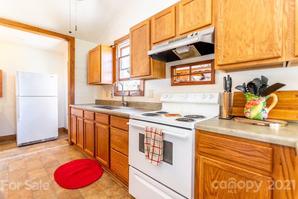 741 County Road Waynesville, NC 28785 - Photo 5 of 42 a kitchen with a sink cabinets and appliances