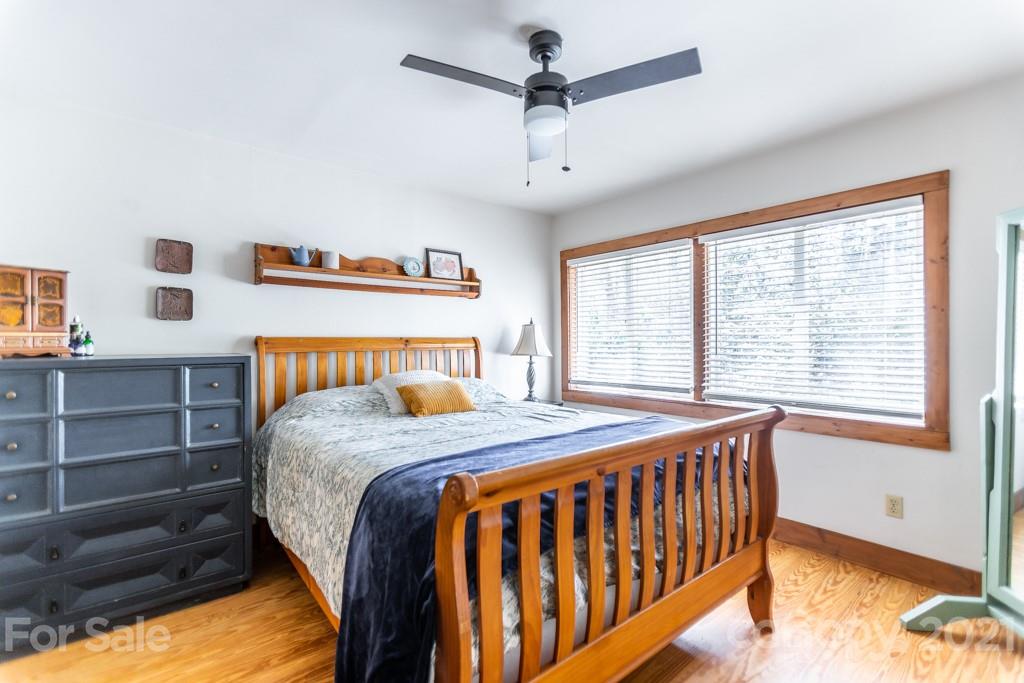 741 County Road Waynesville, NC 28785 - Photo 6 of 42 a bedroom with a bed and a window