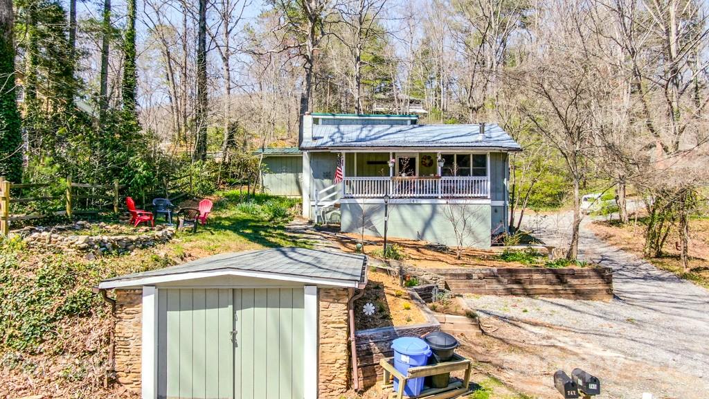 741 County Road Waynesville, NC 28785 - Photo 8 of 42 a view of a house with a yard