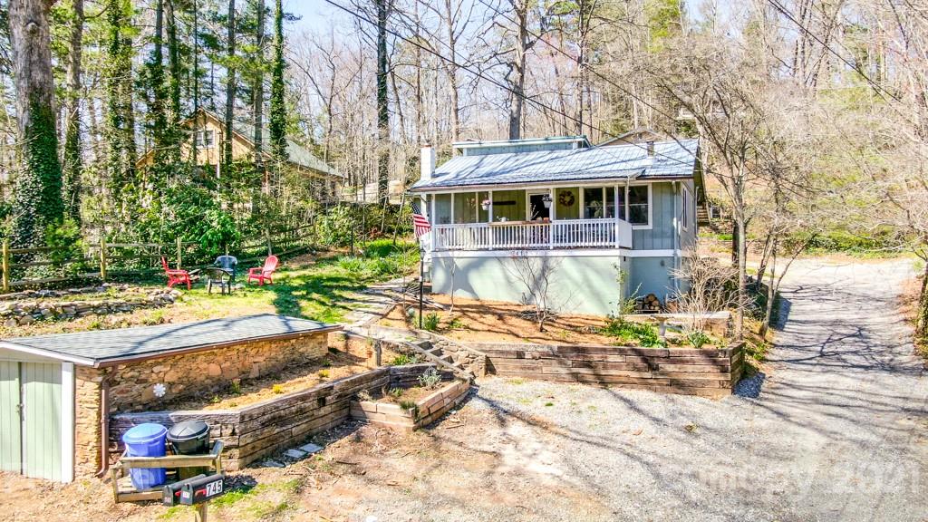 741 County Road Waynesville, NC 28785 - Photo 10 of 42 a front view of a house with a yard