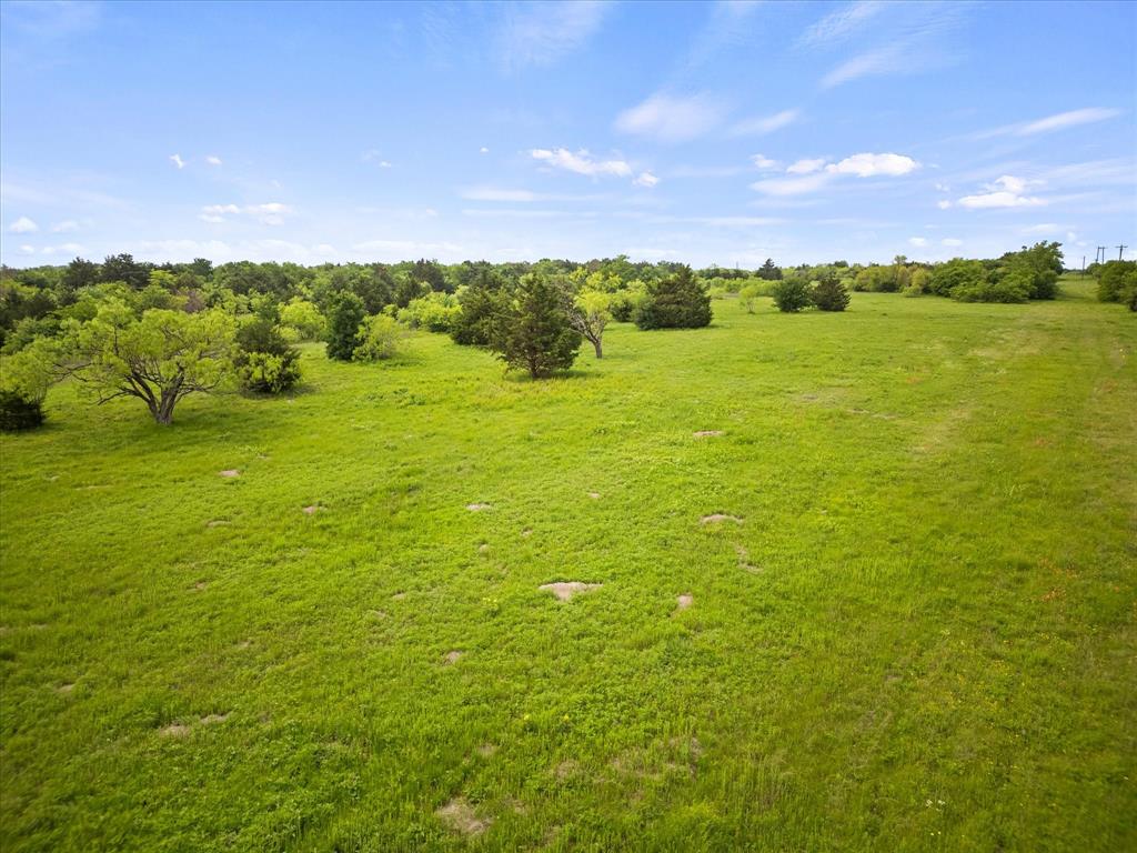 19498 Highway 34, Unit 1B Terrell, TX 75161 - Photo 8 of 11 a view of an ocean and a yard