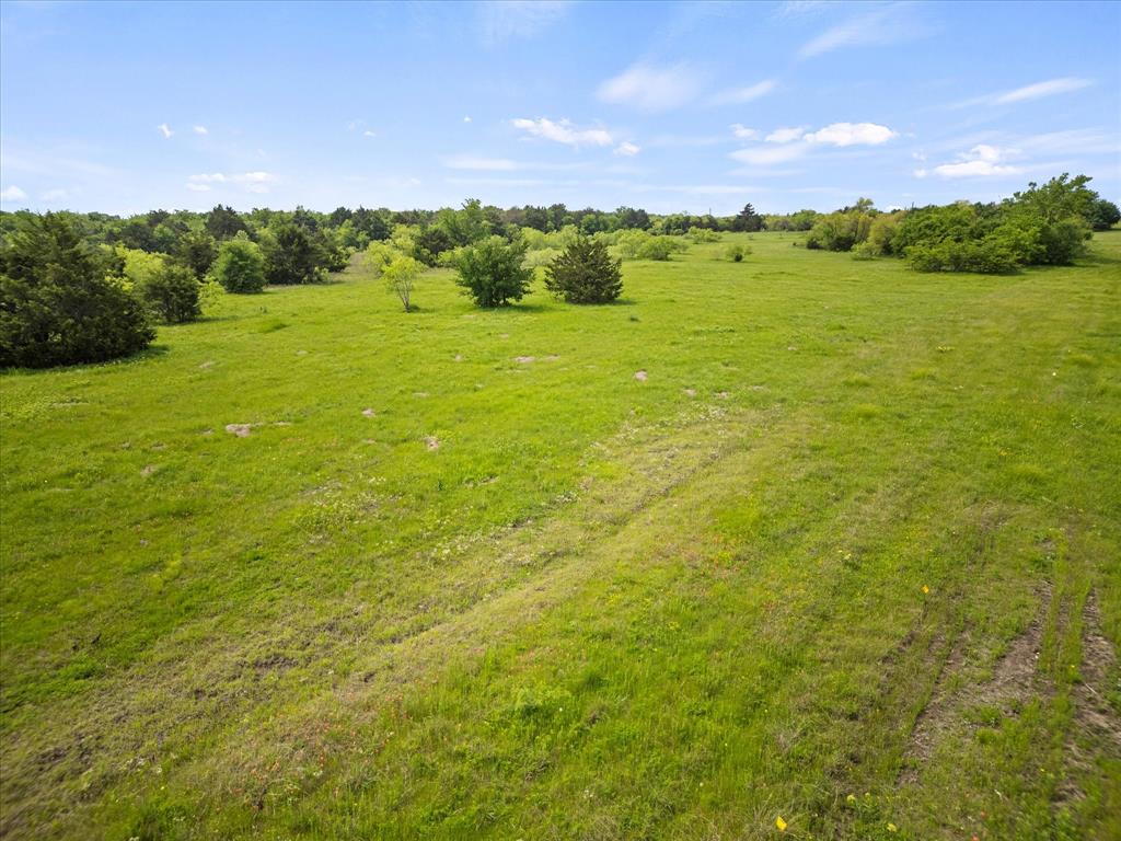19498 Highway 34, Unit 1B Terrell, TX 75161 - Photo 10 of 11 a view of a lake from a yard