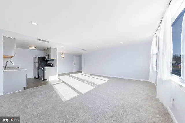 a view of an empty room with a window