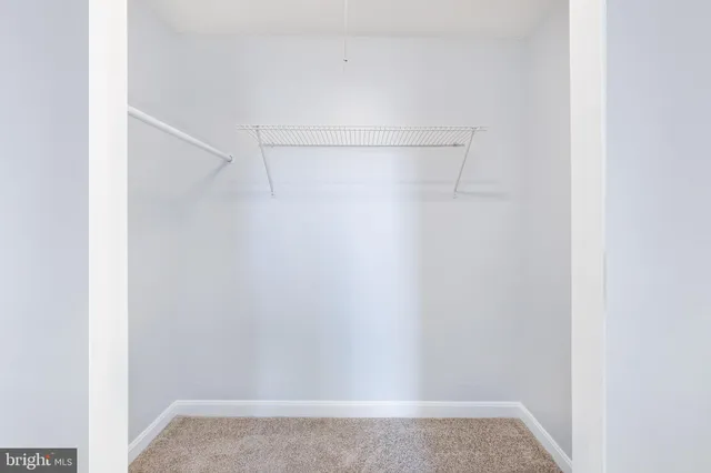 a view of hallway with wooden floor