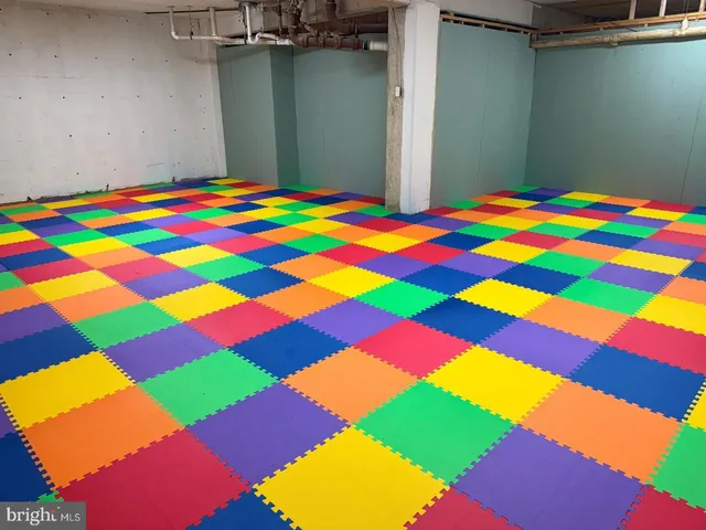 a view of a building with car parked