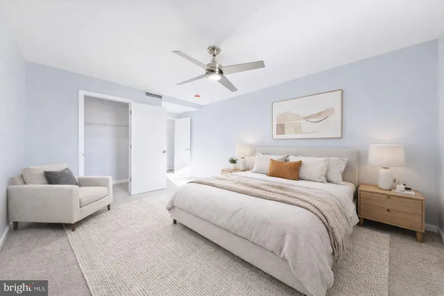 a bedroom with a bed and a couch