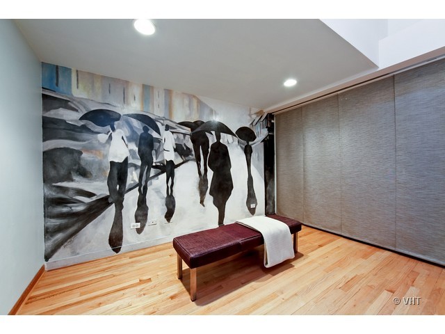 1000 West Washington Boulevard, Unit 428 Chicago, IL 60607 - Photo 13 of 16 a view of walk in closet with clothes and shoes