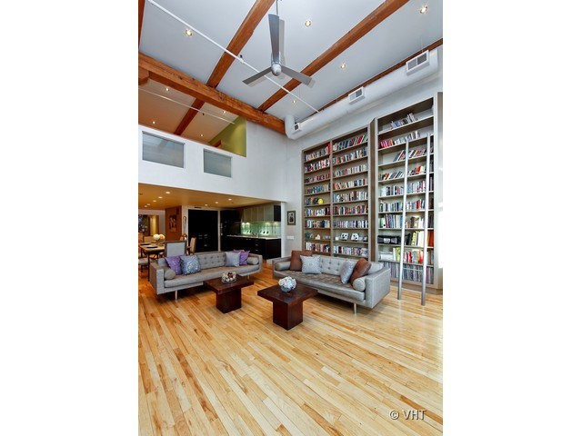 1000 West Washington Boulevard, Unit 428 Chicago, IL 60607 - Photo 3 of 16 a living room with furniture and a fireplace