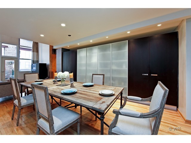 1000 West Washington Boulevard, Unit 428 Chicago, IL 60607 - Photo 6 of 16 a view of a dining room with furniture