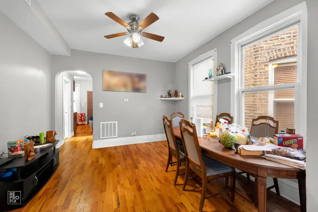 a dining room with furniture and window