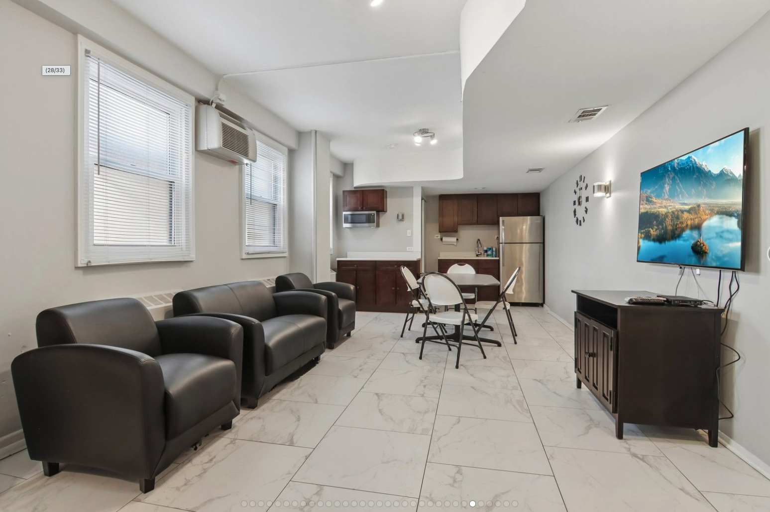 2909 North Sheridan Road, Unit 1201 Chicago, IL 60657 - Photo 15 of 16 a living room with furniture and a window