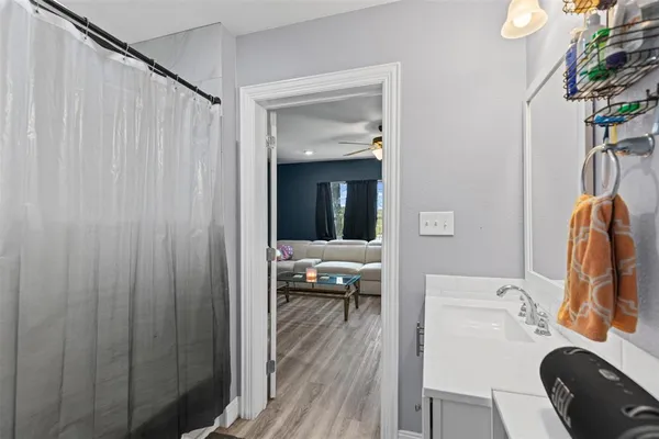 a en suite bathroom with a sink and a mirror