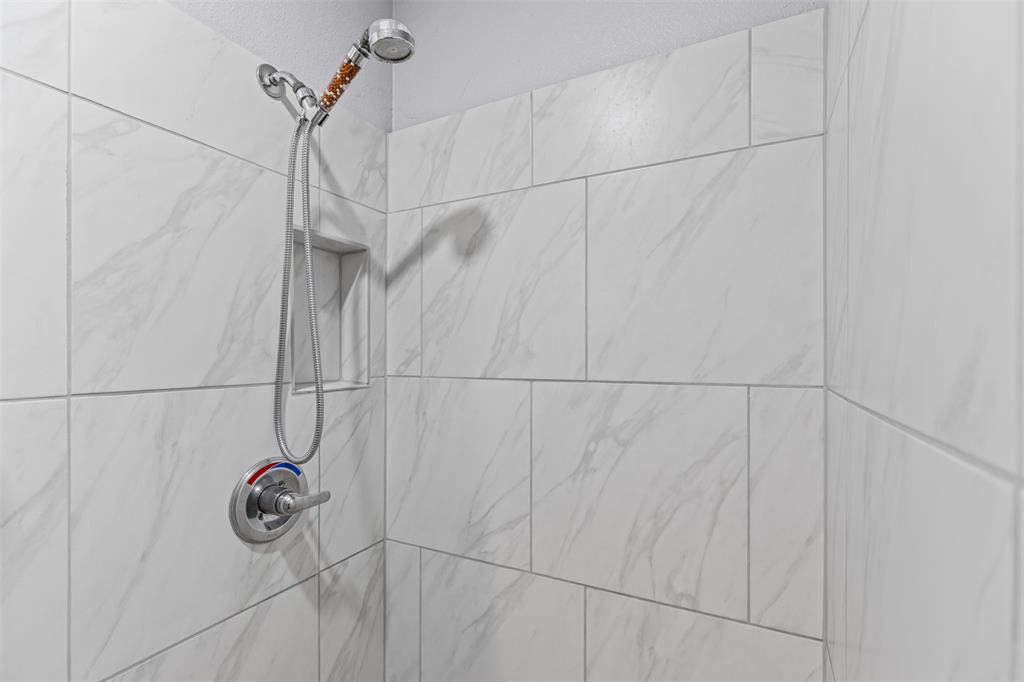 105 South Lavaca Street Whitney, TX 76692 - Photo 23 of 40 a bathroom with a shower