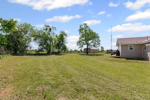 a view of a field with an trees