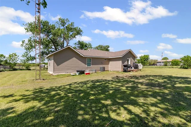a house view with a garden space