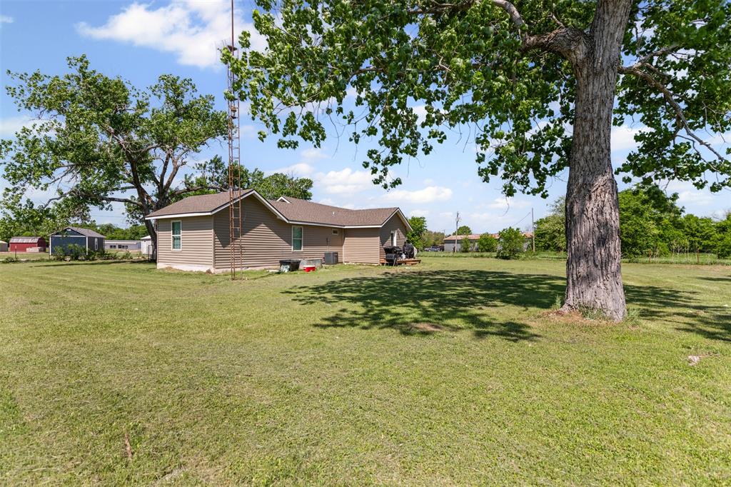 105 South Lavaca Street Whitney, TX 76692 - Photo 30 of 40 a view of a house with a yard