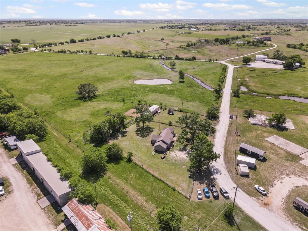 105 South Lavaca Street Whitney, TX 76692 - Photo 34 of 40 an aerial view of ocean and residential houses with outdoor space