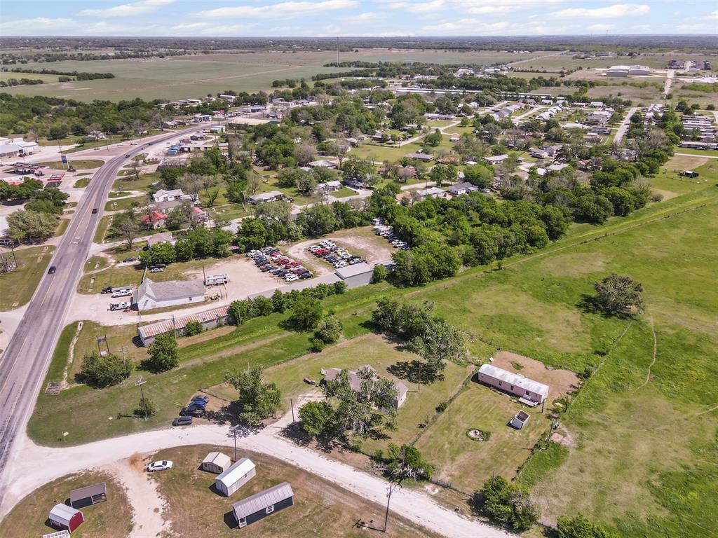 105 South Lavaca Street Whitney, TX 76692 - Photo 36 of 40 an aerial view of a city with lots of residential buildings