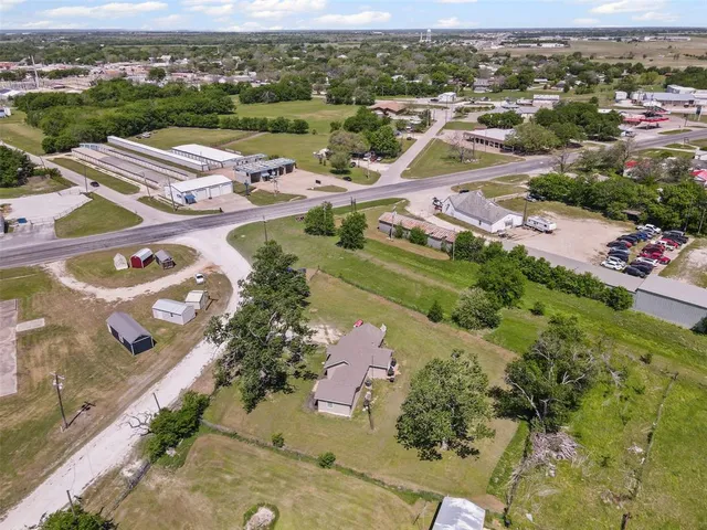 an aerial view of residential houses with outdoor space