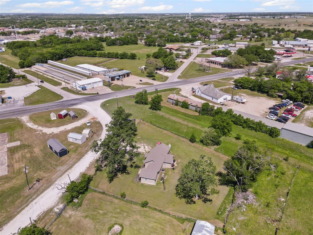 105 South Lavaca Street Whitney, TX 76692 - Photo 37 of 40 an aerial view of residential houses with outdoor space