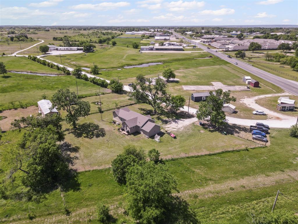 105 South Lavaca Street Whitney, TX 76692 - Photo 39 of 40 an aerial view of a residential houses with outdoor space