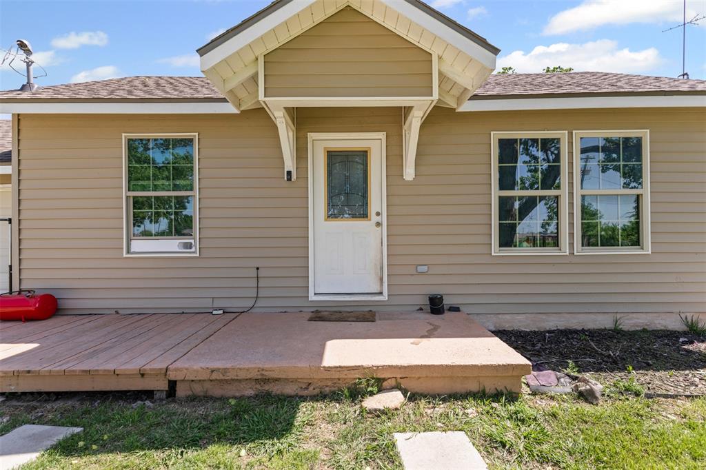 105 South Lavaca Street Whitney, TX 76692 - Photo 7 of 40 a front view of a house with a yard