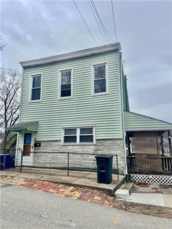 a view of a house with a street
