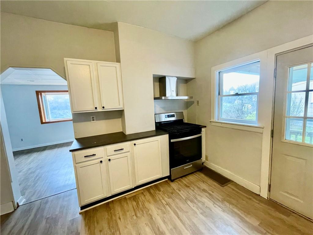 141 Overbeck Street Pittsburgh, PA 15212 - Photo 11 of 29 a kitchen with granite countertop a stove a sink and a granite counter tops