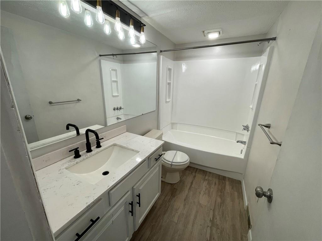 141 Overbeck Street Pittsburgh, PA 15212 - Photo 19 of 29 a bathroom with a sink mirror toilet and shower