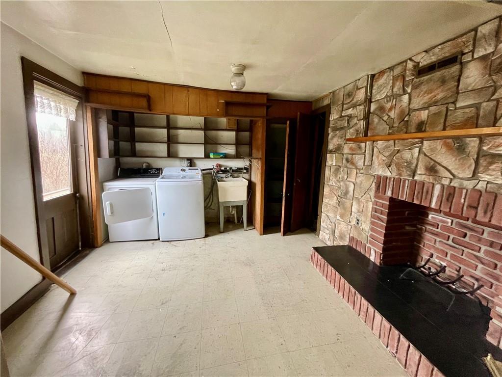 141 Overbeck Street Pittsburgh, PA 15212 - Photo 22 of 29 a living room with a stove and a refrigerator