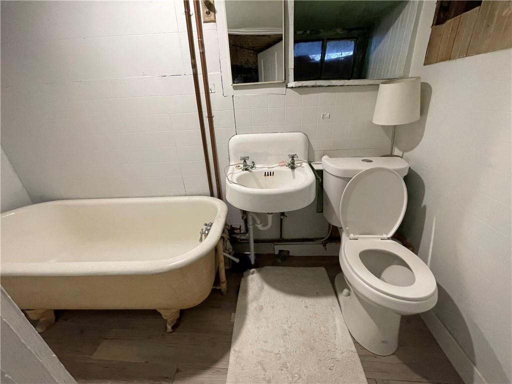 141 Overbeck Street Pittsburgh, PA 15212 - Photo 25 of 29 a bathroom with a toilet and a sink