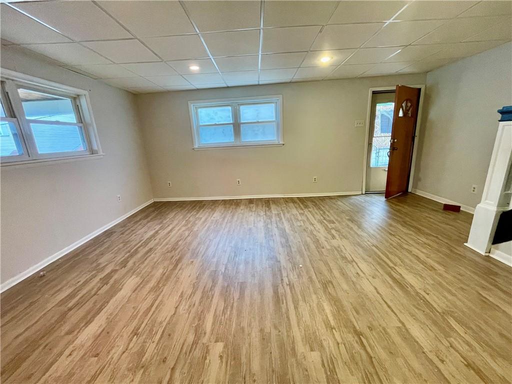 141 Overbeck Street Pittsburgh, PA 15212 - Photo 6 of 29 an empty room with wooden floor and windows