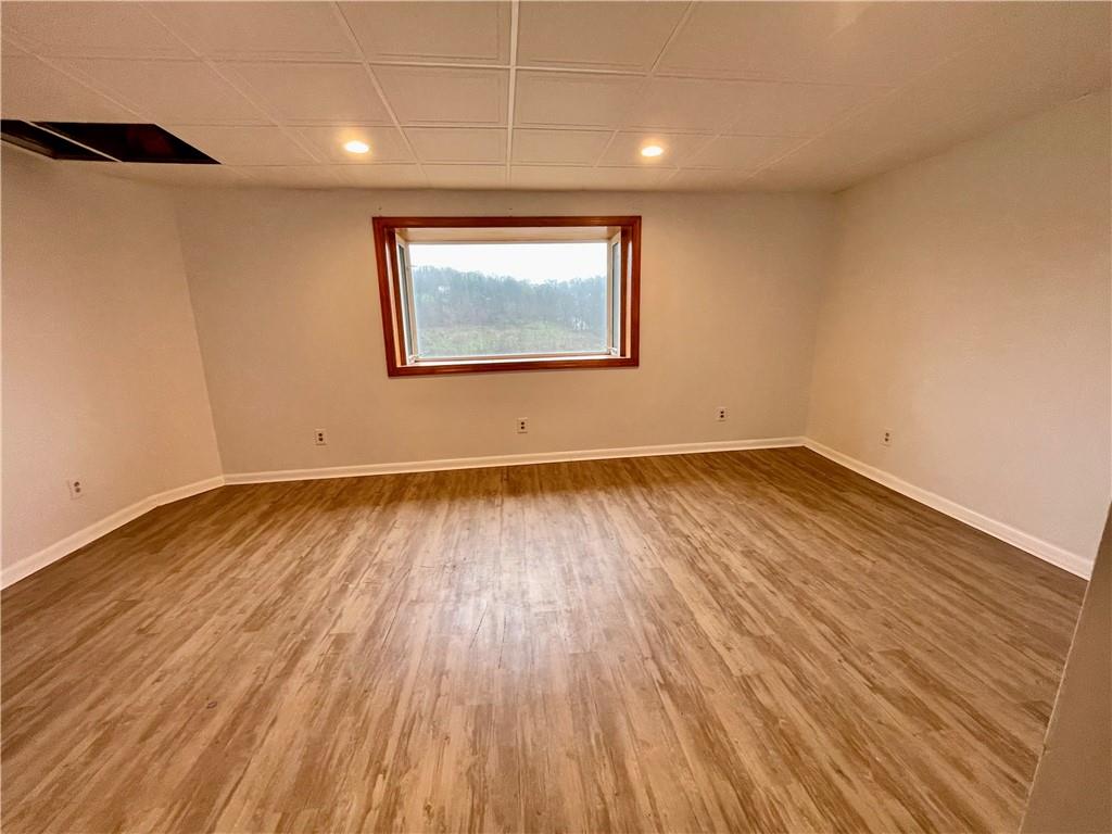 141 Overbeck Street Pittsburgh, PA 15212 - Photo 9 of 29 an empty room with wooden floor and windows