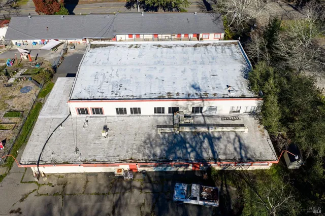 a view of a backyard with a patio and plants