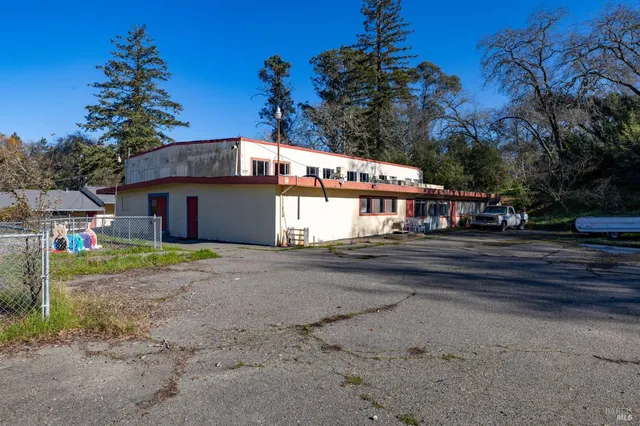 a view of a park with swings and slides