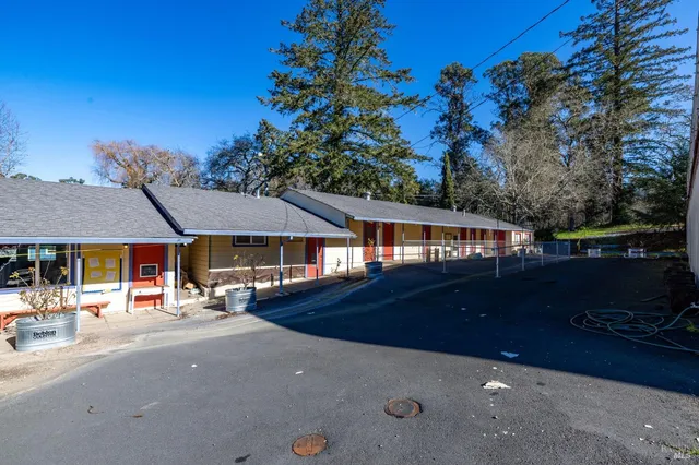 a view of yard with swimming pool and sitting area