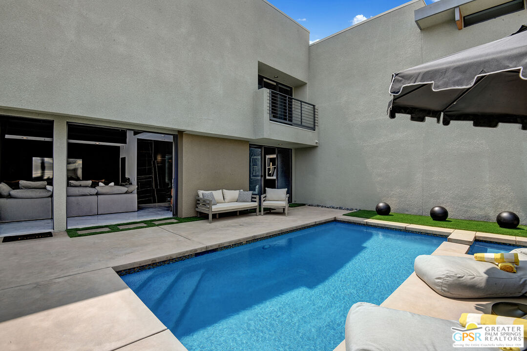 1508 East Baristo Road Palm Springs, CA 92262 - Photo 13 of 62 a living room with furniture pool table and kitchen view