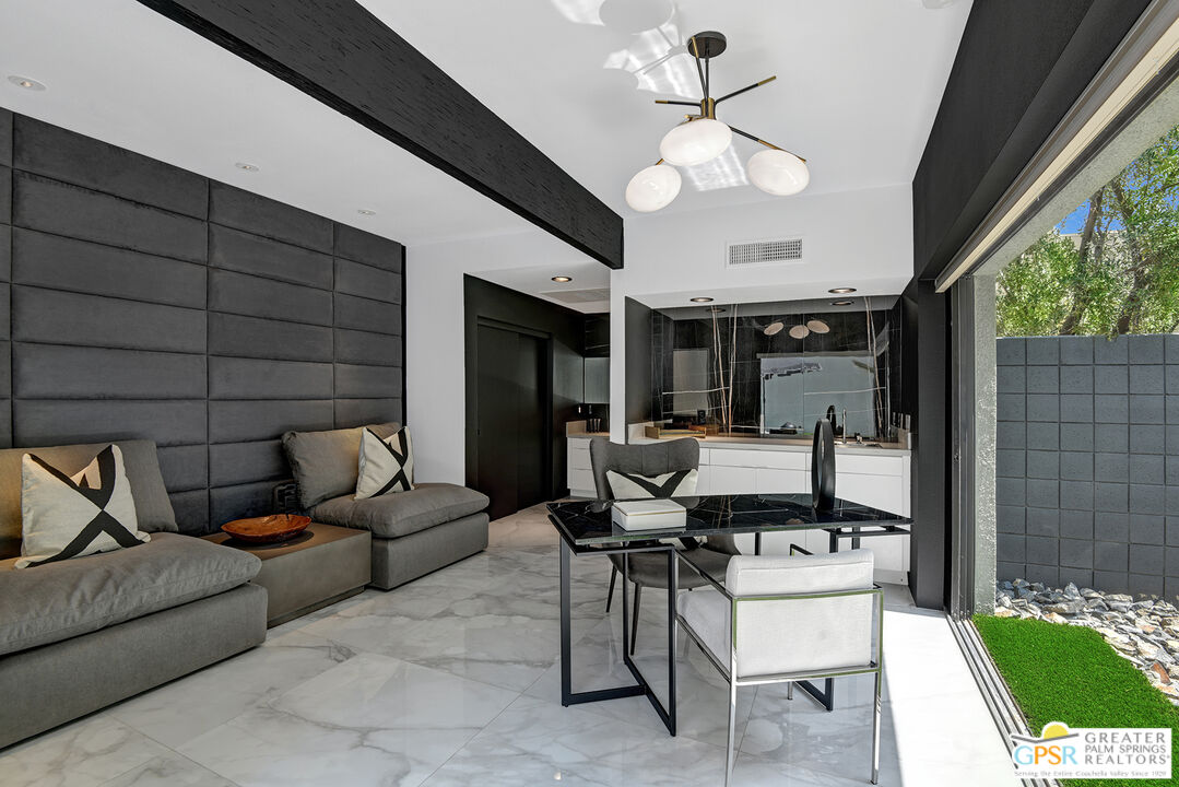 1508 East Baristo Road Palm Springs, CA 92262 - Photo 17 of 62 a living room with furniture a table and chairs