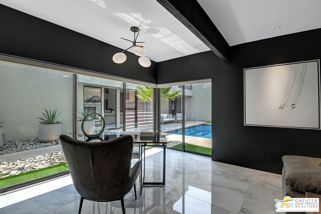 1508 East Baristo Road Palm Springs, CA 92262 - Photo 18 of 62 a dining room with furniture and wooden floor