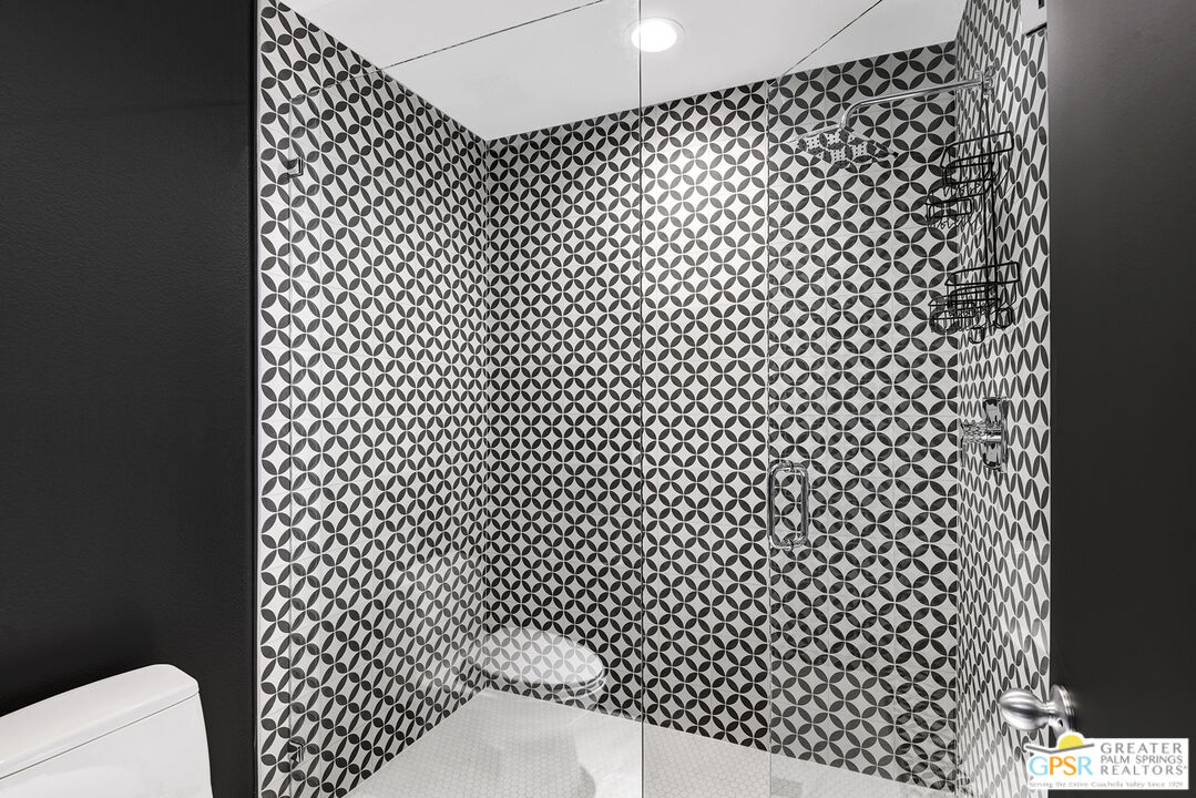 1508 East Baristo Road Palm Springs, CA 92262 - Photo 23 of 62 a bathroom with a black white checkered floor