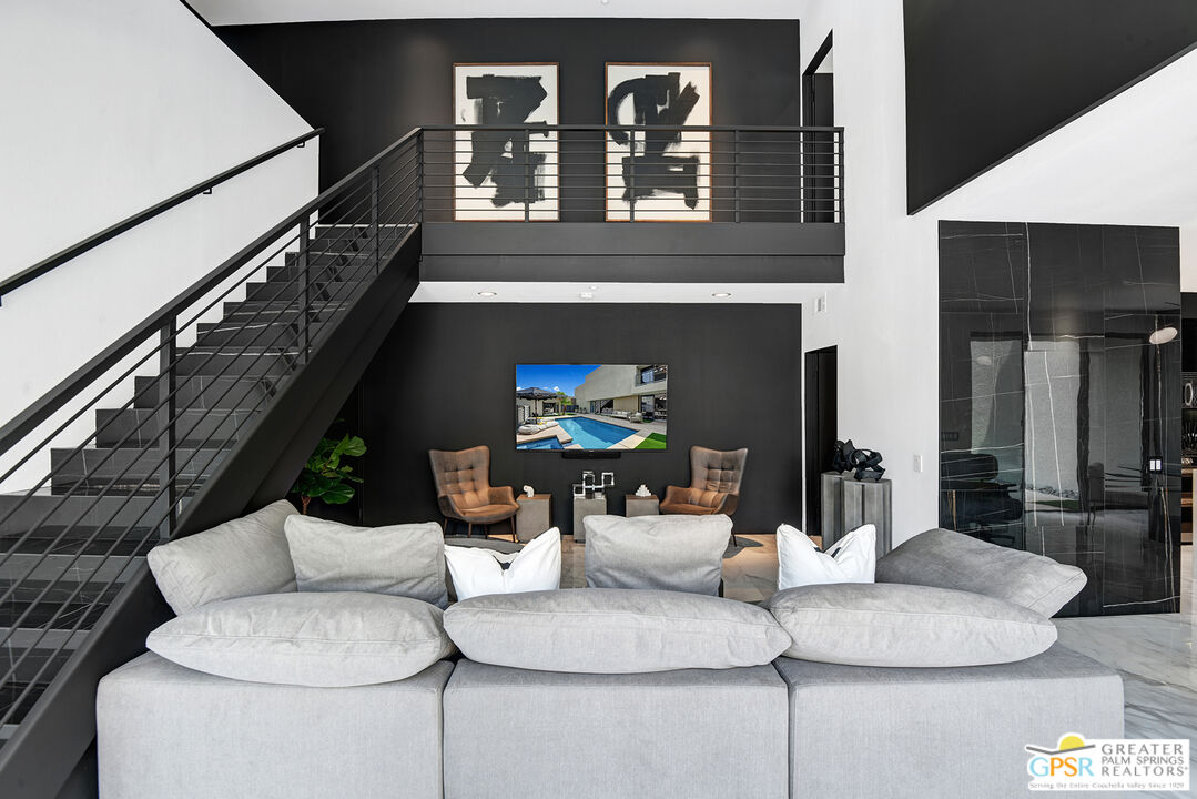 1508 East Baristo Road Palm Springs, CA 92262 - Photo 27 of 62 a living room with furniture and a fireplace