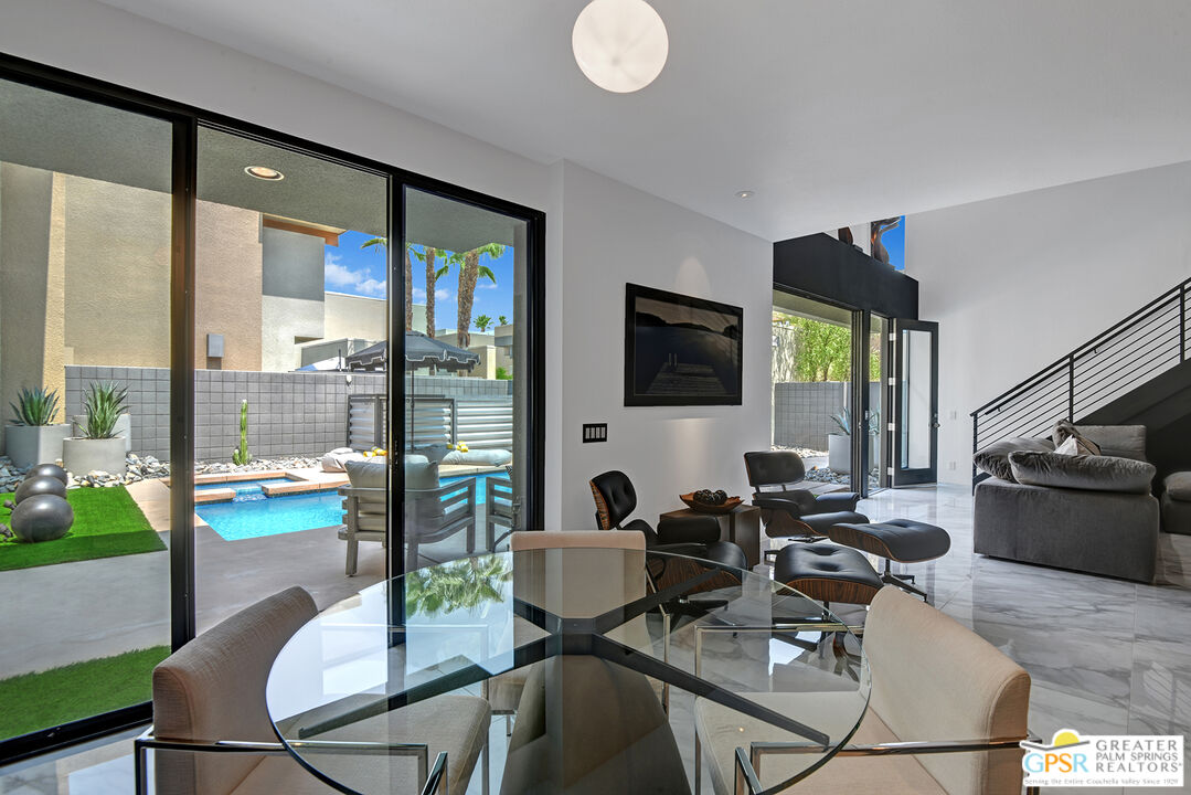 1508 East Baristo Road Palm Springs, CA 92262 - Photo 31 of 62 a work room with glass windows and furniture